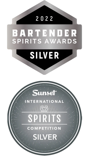 Two silver award badges for 2022 Bartender Spirits Awards and Sunset International Spirits Competition on a white background.
