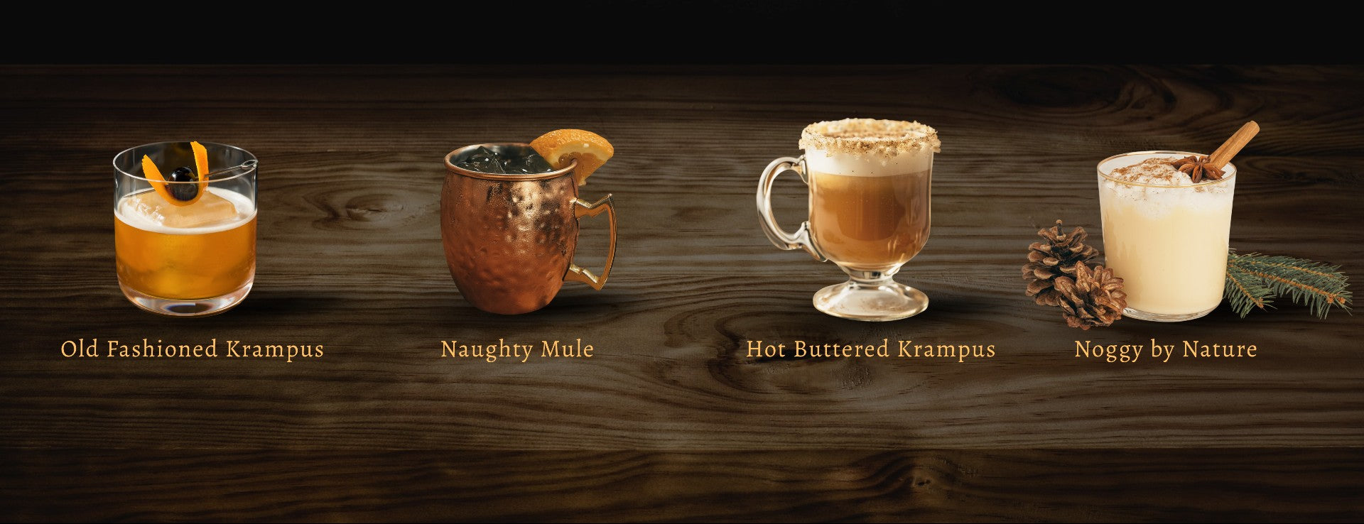 Four holiday-themed cocktails displayed on a wooden surface with names underneath.